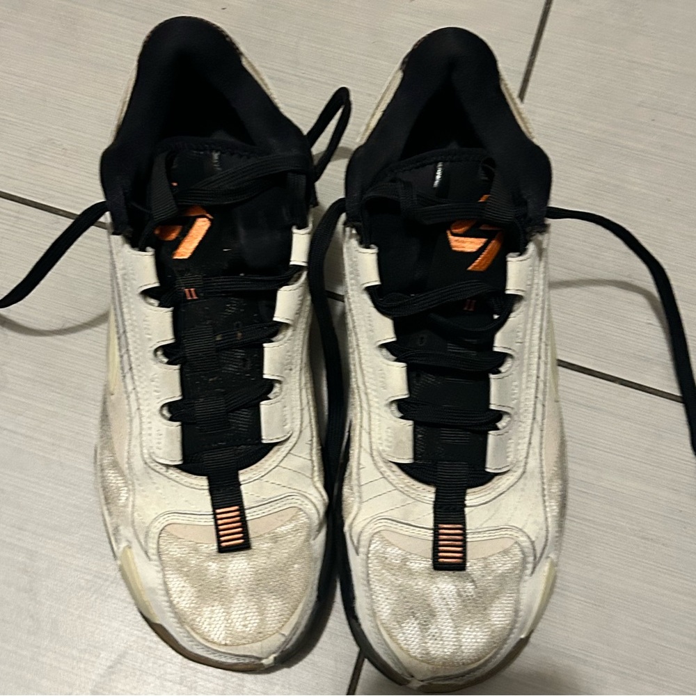 Jordan Black and White Athletic Shoes with Orange Accents